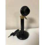 A Bakelite candlestick telephone