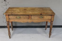 A Victorian pine kitchen table fitted two drawers