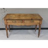 A Victorian pine kitchen table fitted two drawers