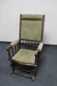 An antique mahogany American style rocking chair