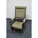 An antique mahogany American style rocking chair