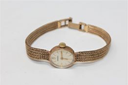 A lady's 9ct gold wristwatch on 9ct gold integral strap CONDITION REPORT: 16.