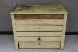 An antique pine six drawer painted chest
