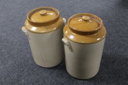 A pair of glazed pottery lidded storage jars