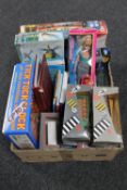 A box containing die cast vehicles, Barbie dolls,