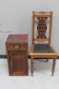 An antique mahogany dining chair and a pot cupboard