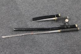 A Japanese samurai style sword and similar dagger