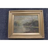 An antique gilt framed oil on canvas - cattle by a river,