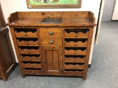 A Barker & Stonehouse rustic pine wine storage cabinet,