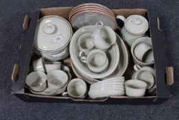 A box of thirty-four pieces of Denby stoneware tea and dinner ware