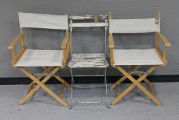 A metal wooden seated garden chair and two director's chairs