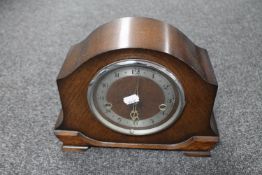 An oak cased Smiths Enfield mantel clock with pendulum and key