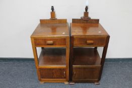 A pair of oak Art Deco bedside stands fitted with lamps