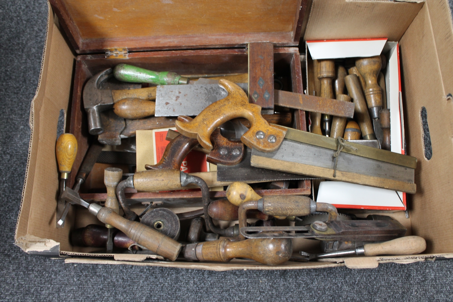 A box of joiner's tools, hand saws, braces,