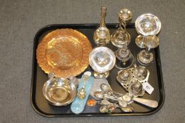 A tray of silver plated items, cruet set, tea spoons, silvered metal and copper plaques etc.
