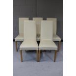 A set of five cream leather high back dining chairs