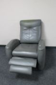 A grey leather manual reclining armchair