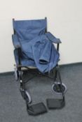 A folding light weight wheel chair in carry bag