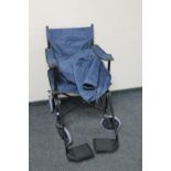 A folding light weight wheel chair in carry bag