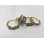 Four 9ct gold dress rings set with gemstones manufactured by QVC, 8.6g gross.