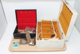 A tray of two jewellery boxes containing costume jewellery, coins,