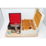 A tray of two jewellery boxes containing costume jewellery, coins,