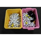 Two crates of golf balls