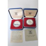 Two cased silver crowns,