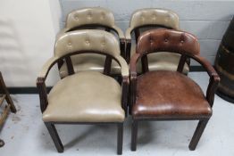 Four pub armchairs upholstered in leather