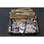 A box containing Las Vegas playing cards, one volume of David Copperfield by Dickens,