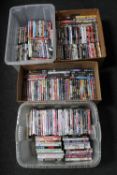 Four boxes containing a large quantity of assorted DVD's