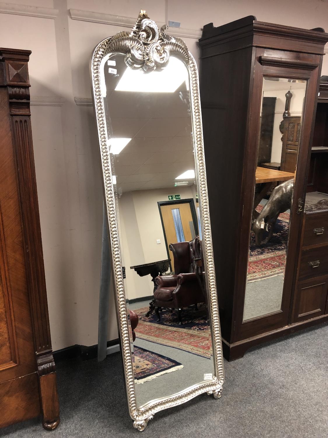 An ornate silvered easel mirror,