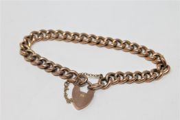 A 9ct gold curb link padlock bracelet CONDITION REPORT: 10.