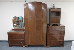 A three piece 1930's oak bedroom suite and bedside cabinet