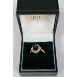 An 18ct gold diamond and sapphire cluster ring,