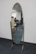 A cheval mirror on gilt stand