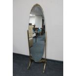 A cheval mirror on gilt stand