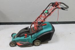 A Bosch electric lawn mower with grass box (continental plug)