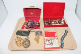 A tray of a quantity of costume jewellery, identity bracelet, vintage spectacles in case,