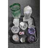 A tray of assorted glass ware including a glass mantel clock case, paperweights, preserve pots,