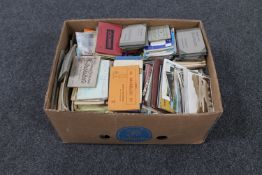 A box of large quantity of antique and later postcards and postcard snap shot books