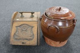 An antique glazed terracotta lidded pot and an Edwardian oak coal receiver