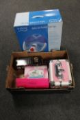 A boxed foot spa together with a further box containing manicure and pedicure kits,