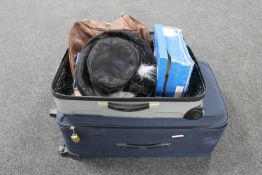 Two luggage cases of handbags, lady's hats,