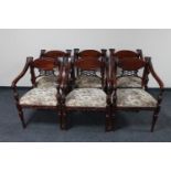 A set of six Victorian style armchairs upholstered in floral tapestry fabric