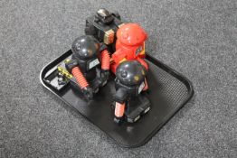 A tray of four 1980's battery operated robots