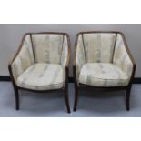 A pair of beech framed armchairs in floral striped fabric