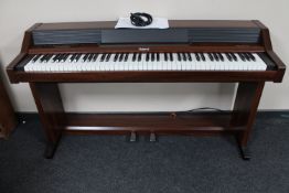 A Roland Piano Plus 450 electric piano HP-450