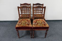 A set of four late Victorian mahogany dining chairs upholstered in tapestry fabric