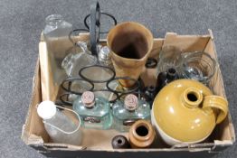 A box of stoneware flagon, glass bottles, metal wine rack,
